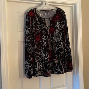 Gently used long sleeve shirt with red and white flowers
